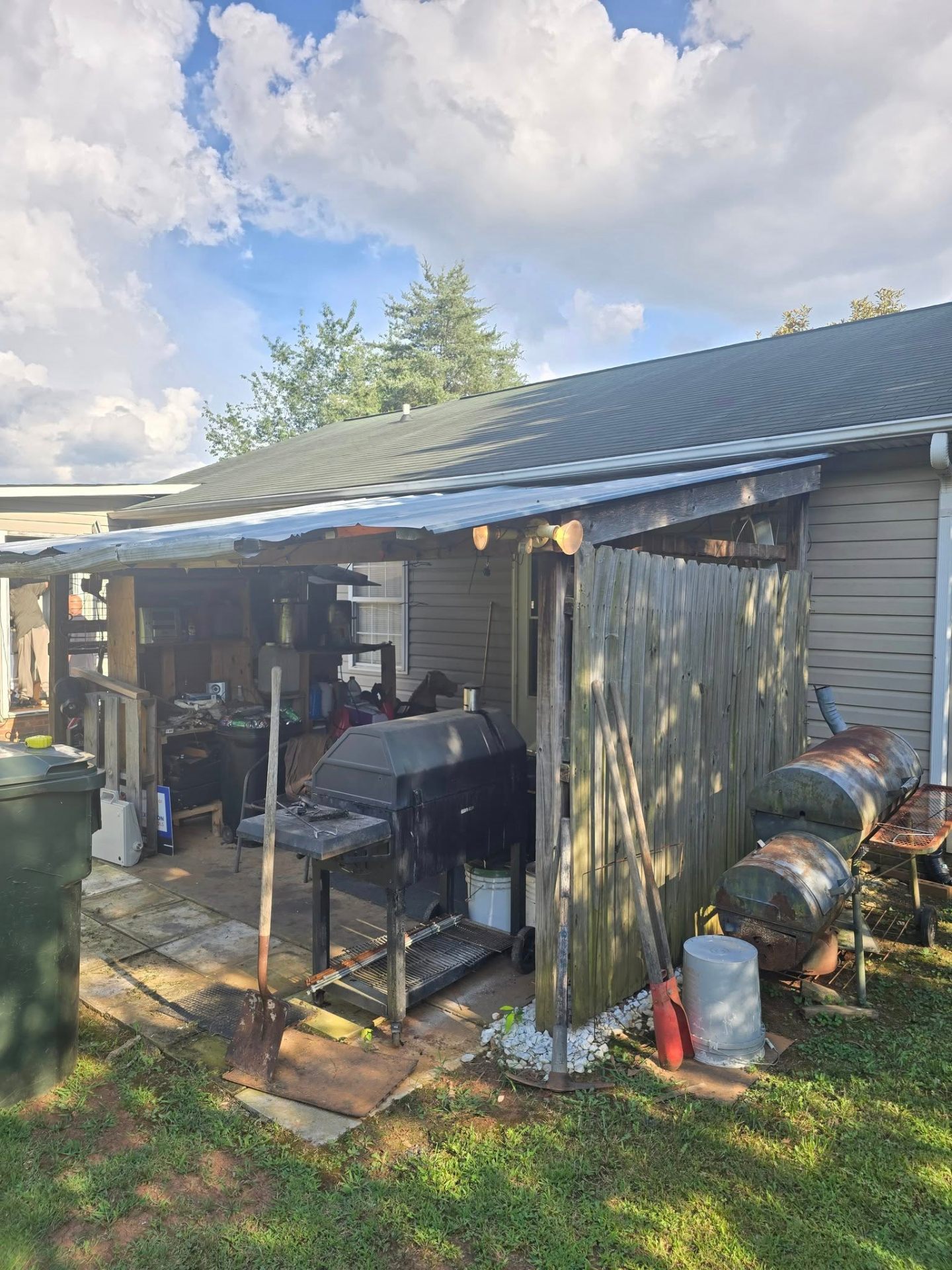 Original back patio with old metal awning before construction